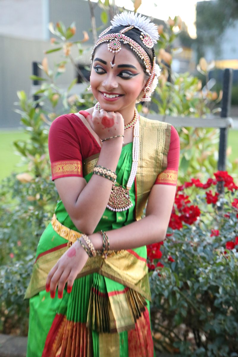 Shriya in red and green costume, seventh year, 2019